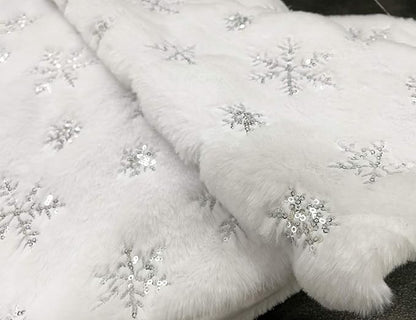 White Christmas tree skirt with sequin snowflake decorations